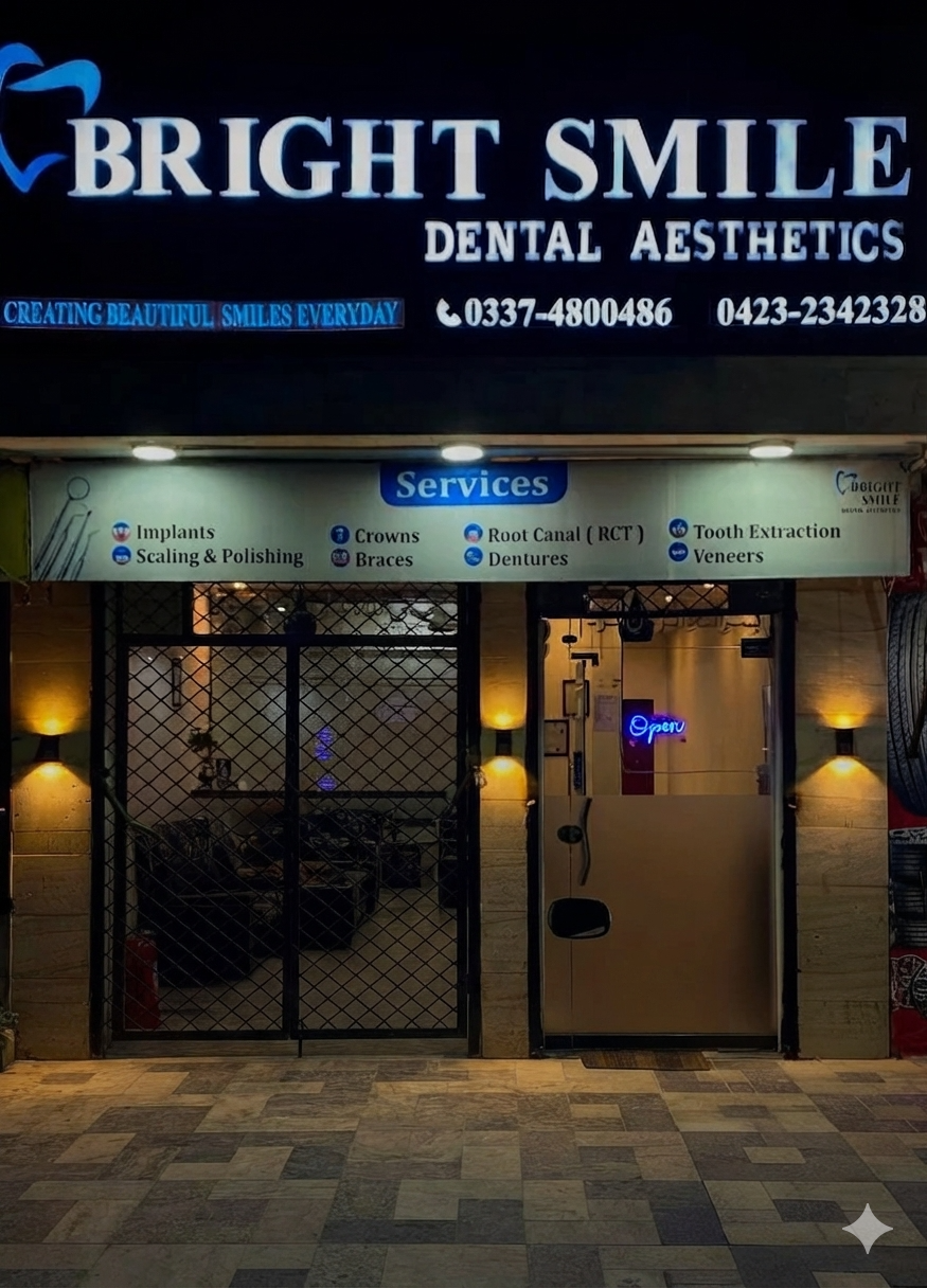 Bright Smile Dental Aesthetics clinic entrance and signboard at night in Johar Town